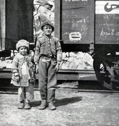'This brother and sister, orphans, were begging for a train-ride to some other town, where there might be bread' (Nat. Geog: Volume XXXVI, Number Five, November 1919, p. 404 